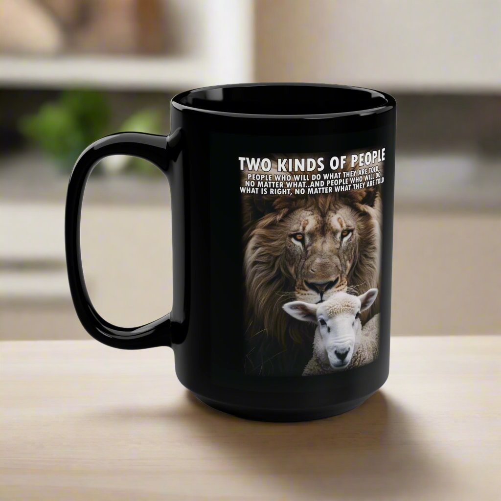 Black 15oz ceramic mug featuring a vibrant lion and sheep illustration with a bold message promoting integrity and strength; lead and BPA-free, microwave and dishwasher safe.