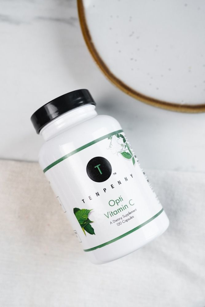 Opti Vitamin C bottle laying on a counter top