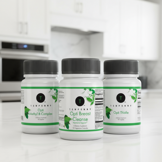 Three supplement bottles labeled 'Opti Methyl B Complex', 'Opti Breast Cleanse', and 'Opti Thistle' on a kitchen counter.