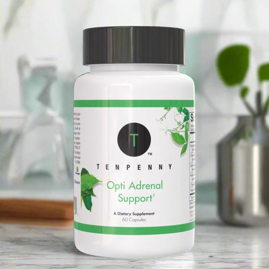 Opti Adrenal Support bottle placed on a kitchen counter, providing natural support for stress resilience and energy balance.