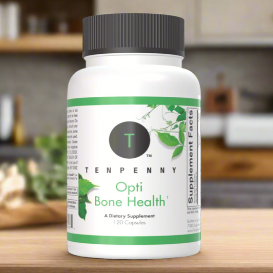 Person taking Opti Bone Health supplement in a lifestyle setting, promoting bone strength, calcium absorption, and joint health.