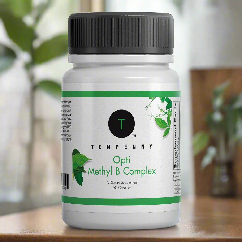Supplement bottle labeled 'Tenpenny Opti Methyl B Complex' on a wooden surface with a blurred natural background.