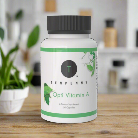 Supplement bottle labeled 'Opti Vitamin A' by Tenpenny on a surface with plants in the background